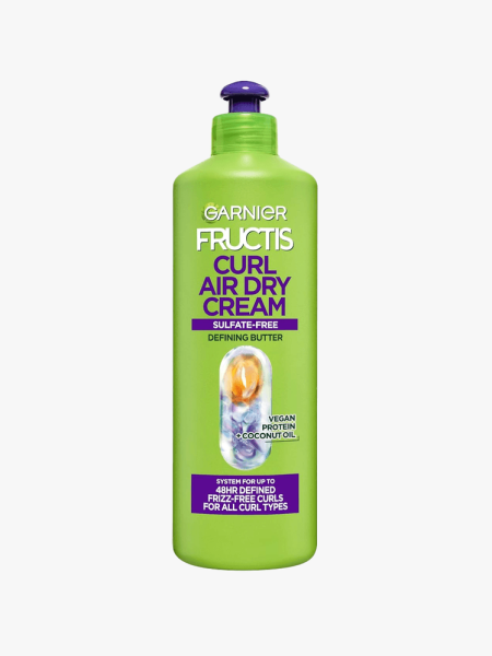 Garnier Fructis Triple Nutrition Curl Nourish Butter Cream Leave-In Treatment in branded component on a light gray background